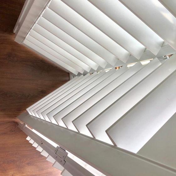 Close-up of angled Rigidcore shutter louvres above a wood floor